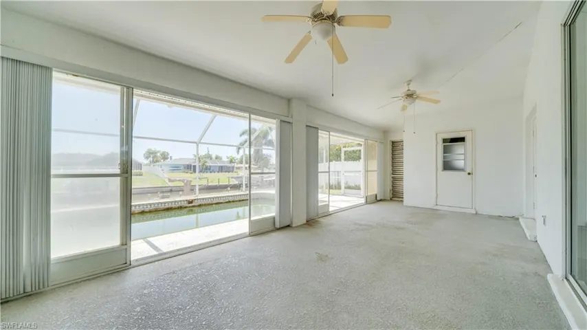 Florida room with a half bath & a shower is in the Nitch to the left of the door.