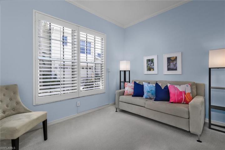 Bedroom 3 has a queen size pull out bed with linens, plantation shutter and french doors with curtains