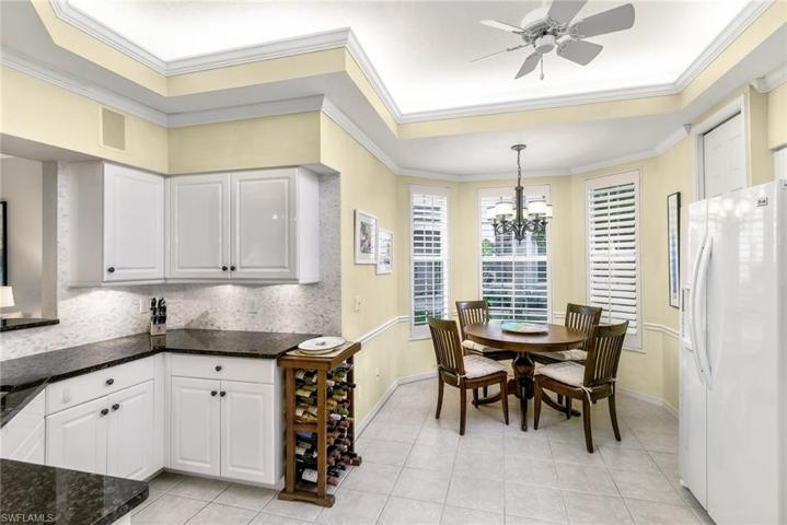 Eat-in kitchen with plantation shutters and electric storm shutters.