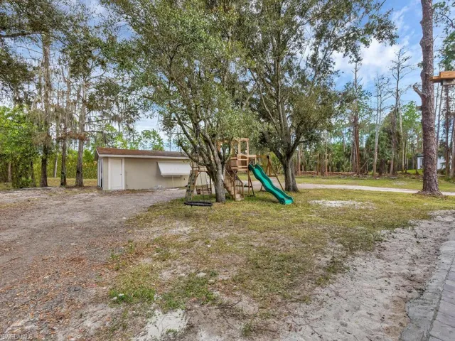 View of yard with a playground