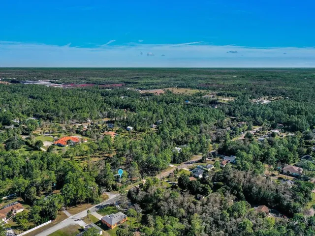 View of property location featuring a heavily wooded area