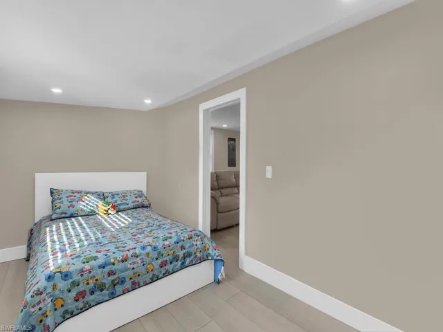 Bedroom featuring light wood finished floors and recessed lighting