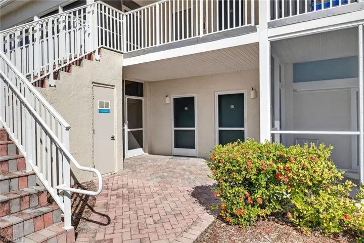 Entrance to property with a patio and stucco siding
