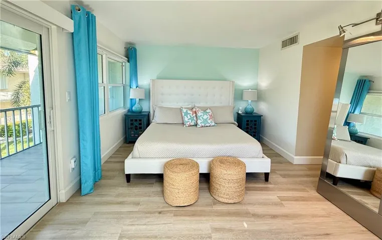 King size bed with access to upstairs balcony
