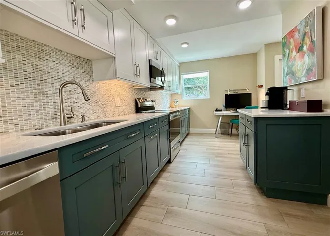 Solid wood cabinets with tile backsplash and LED lighting