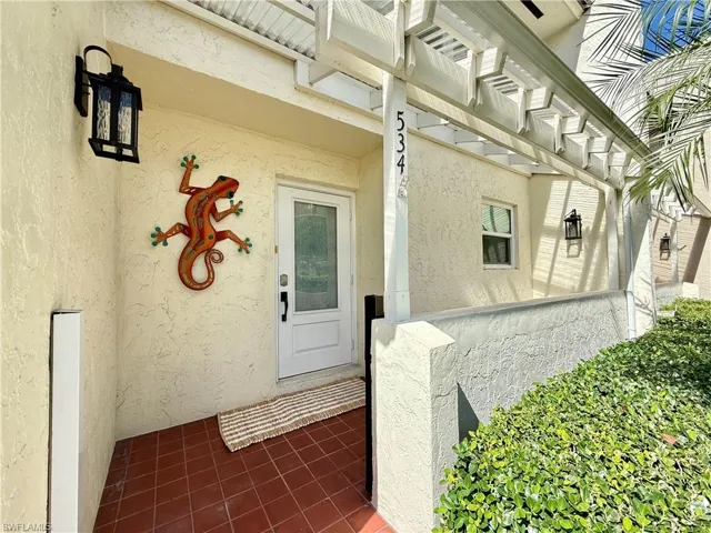 Pergola covered front porch