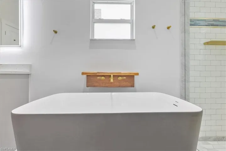 Master Full bathroom with a freestanding bath