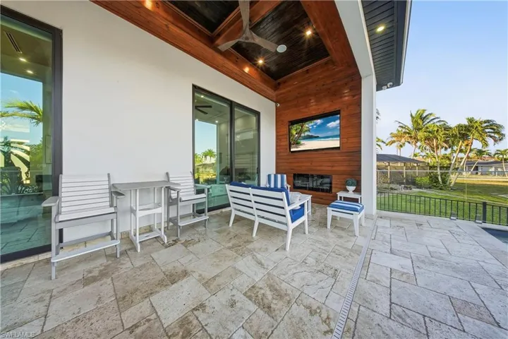 View of patio / terrace with outdoor seating and a ceiling fan