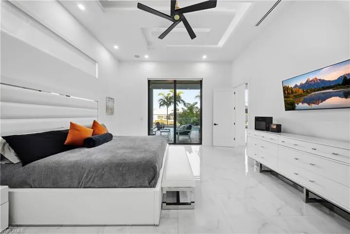 Master Bedroom featuring access to exterior, ceiling fan, recessed lighting, and coffered ceiling