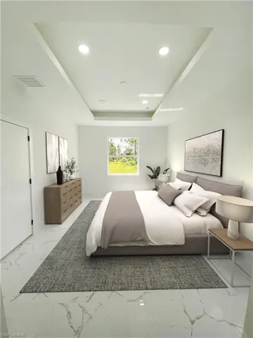 Virtually staged Bedroom with light tile patterned flooring and a raised ceiling