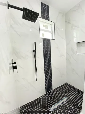 Bathroom with tiled shower