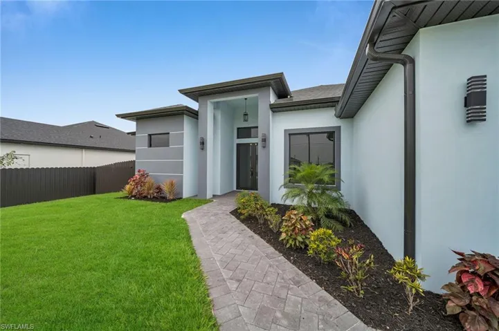 Property entrance with stucco siding