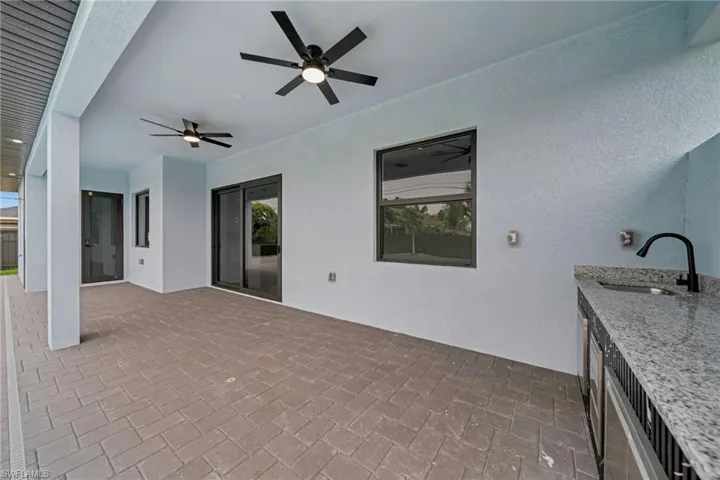 View of patio / terrace featuring a sink and ceiling fan
