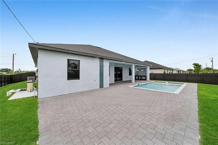 View of pool featuring a patio area and a fenced backyard