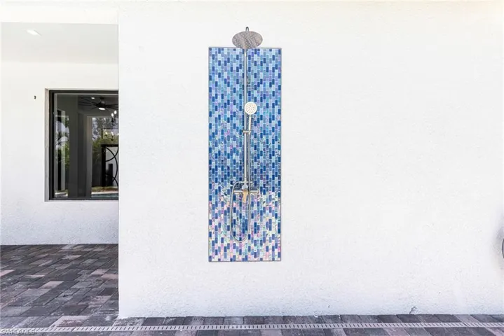 Out door glass shower allows you to rinse off before going inside.