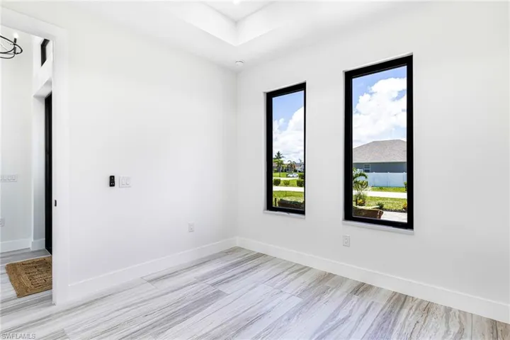 Front bedroom with custom casement windows.