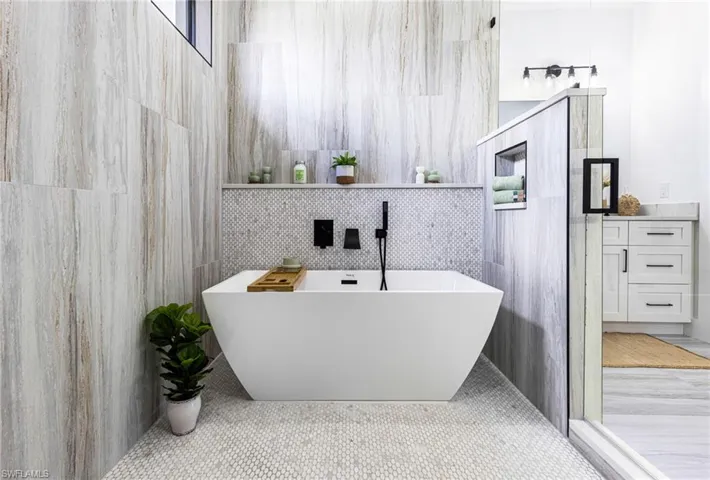 Primary Bathroom is a real Wet Room. Separate tub area with niches and shelves. Enclosed to allow for a real warm bath! Tranquility begins....