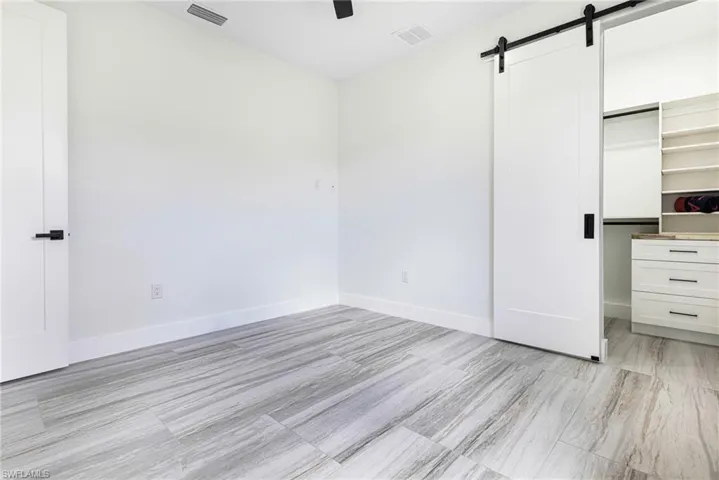 Custom closet with barn styled Door.