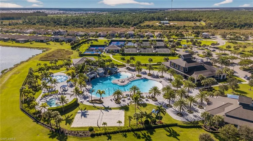 Drone / aerial view of a large body of water and a pool