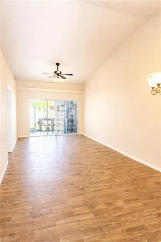 Empty room with light wood-style flooring and baseboards
