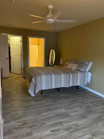 Bedroom featuring light wood finished floors and ceiling fan