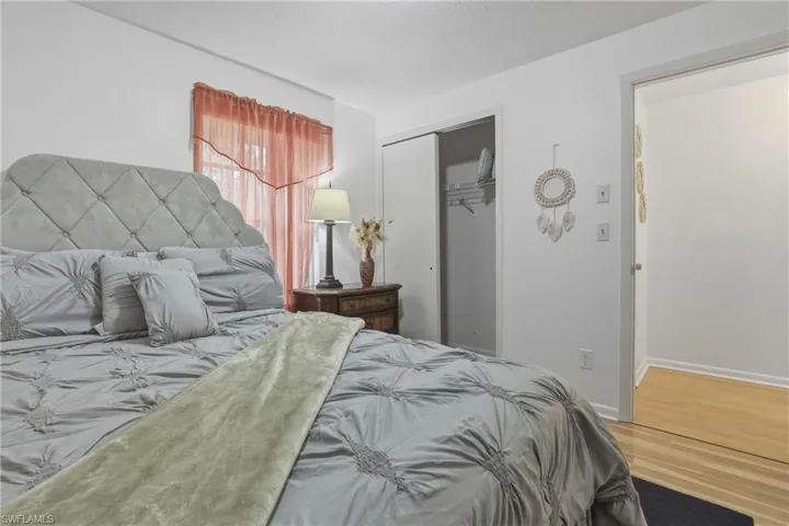 Bedroom #3featuring wood finished floors and a closet