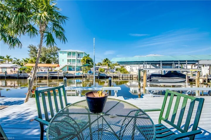 Dock area with boat lift and a water view