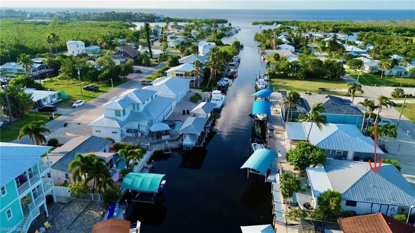 Aerial view of residential area with a nearby body of water