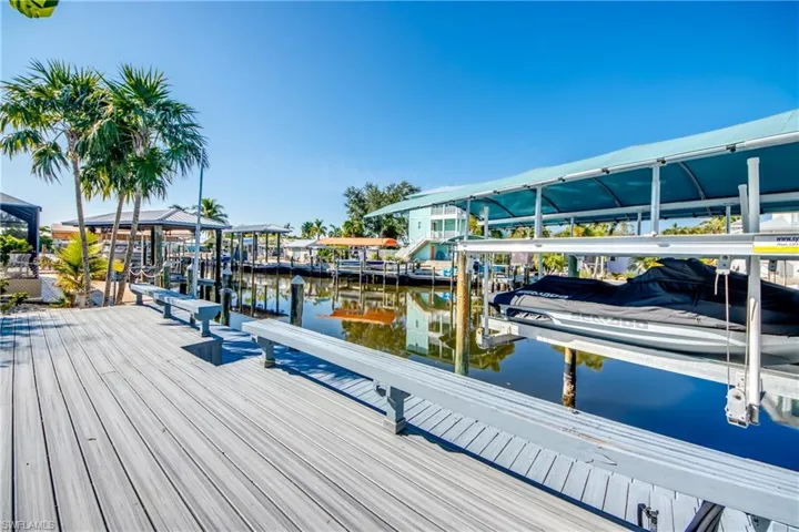 Dock with a water view and boat lift