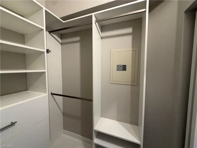 Primary Bedroom Custom Closet 2 with built in safe