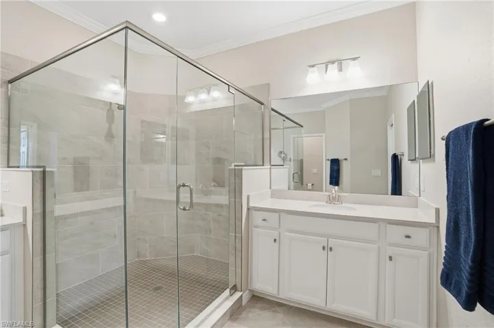 Walk in shower with upgraded tile and frameless shower door