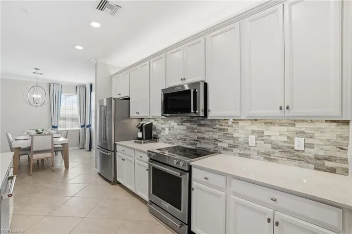 Open kitchen with custom backsplash