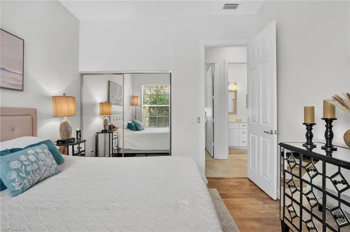 Bedroom with light wood-style flooring and a closet