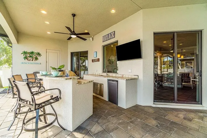 View of patio / terrace featuring a ceiling fan