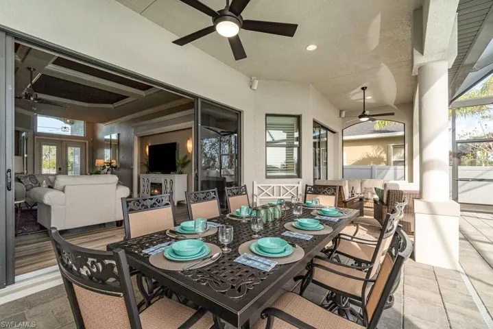 View of patio / terrace featuring ceiling fan, outdoor dining area, and an outdoor hangout area
