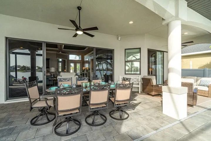 View of patio featuring ceiling fan and outdoor dining area