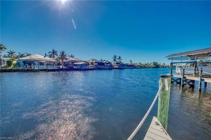 Dock area featuring a water view and boat lift