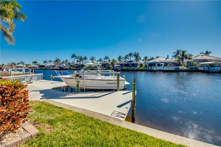 Dock area featuring a water view and boat lift
