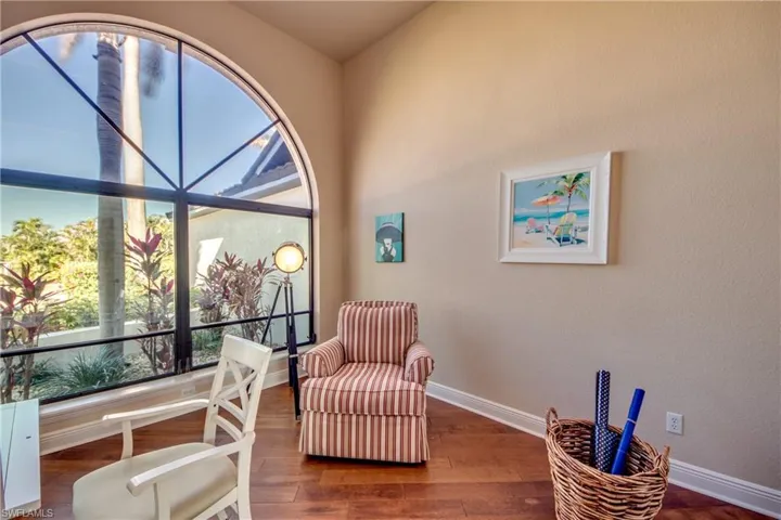 Living area with wood finished floors and baseboards