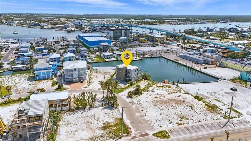 Aerial perspective showcasing a coastal property with waterfront access - Virtually Edited Image