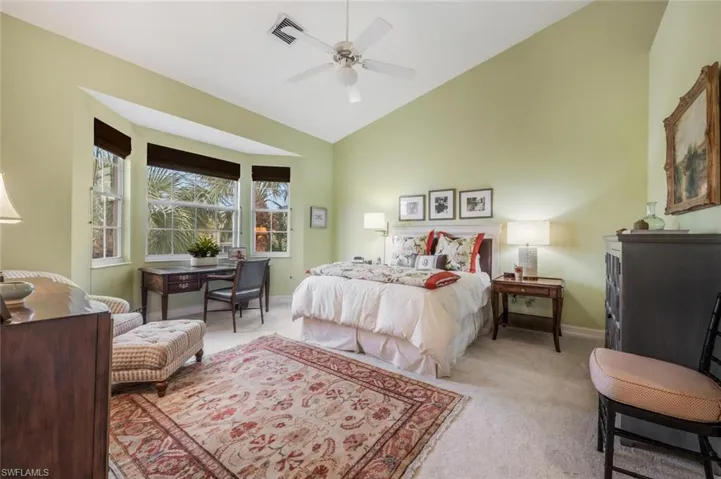 Primary bedroom with space for a desk or sitting area
