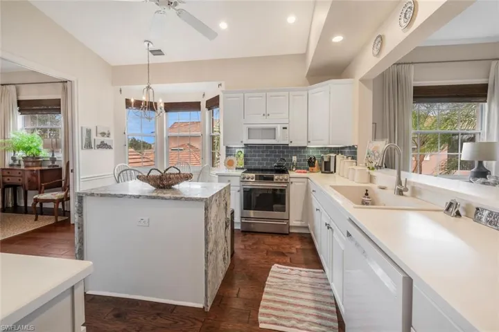 The updated blue tile backsplash really makes the kitchen pop with color