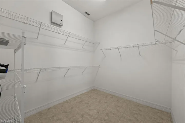 This huge walk-in closet is located in the primary suite, within the primary bath. A perfect location.