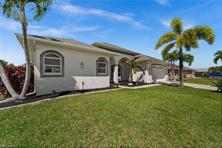 Lovely SE Cape Coral home on a corner lot.