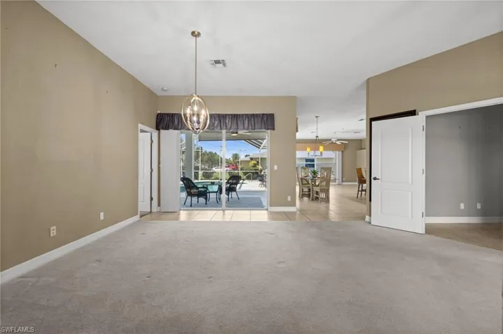 As you enter the home, your view quickly goes toward the expansive lanai and pool.