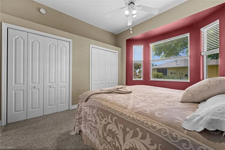 The second bedroom with two closets and a private bathroom.