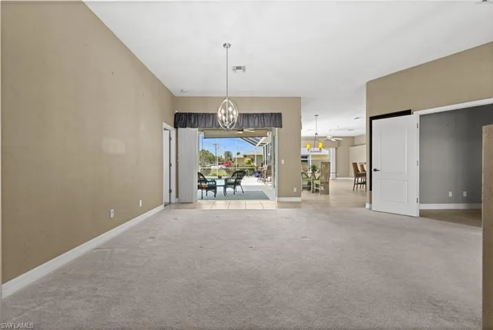 A view from the foyer to the family room! Where does the door on the right lead?