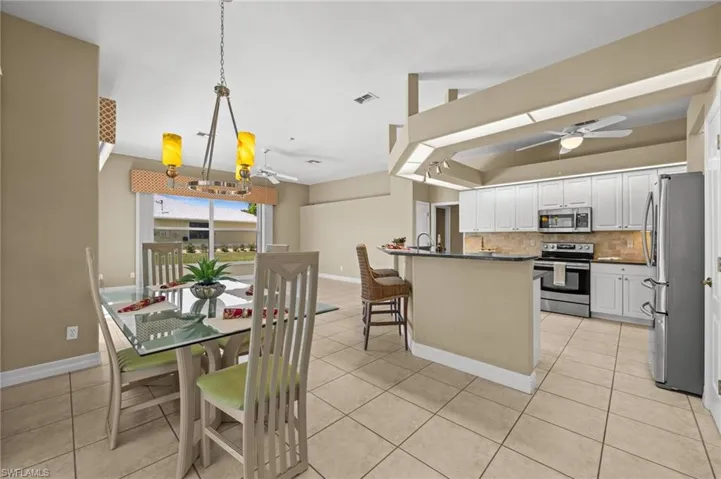 The breakfast area provides convenience and decorative lighting.