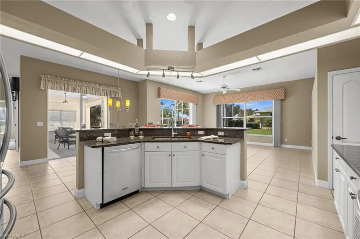The kitchen is perfectly positioned just steps from the family room, the breakfast area, and the lanai and pool area.