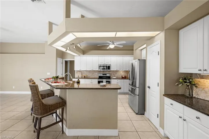 The perfect picture showcasing this homes two pantries. One to the left. One to the right.